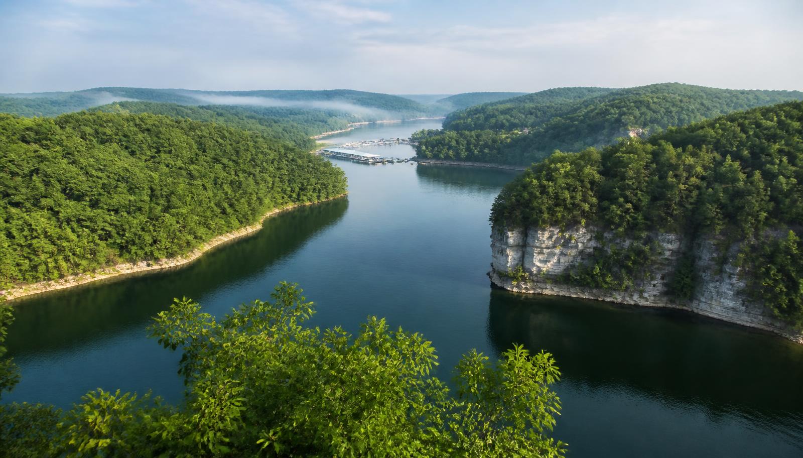 Wooded hills and limestone bluffs along a quiet cove of Lake Cumberland
